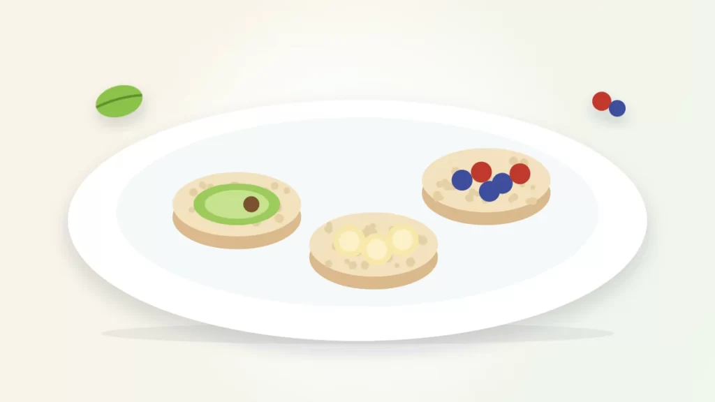 Are rice cakes healthy illustration: rice cakes topped with avocado, banana slices and berries on a plate