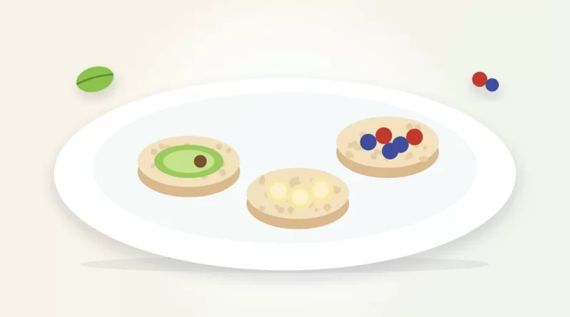 Are rice cakes healthy illustration: rice cakes topped with avocado, banana slices and berries on a plate